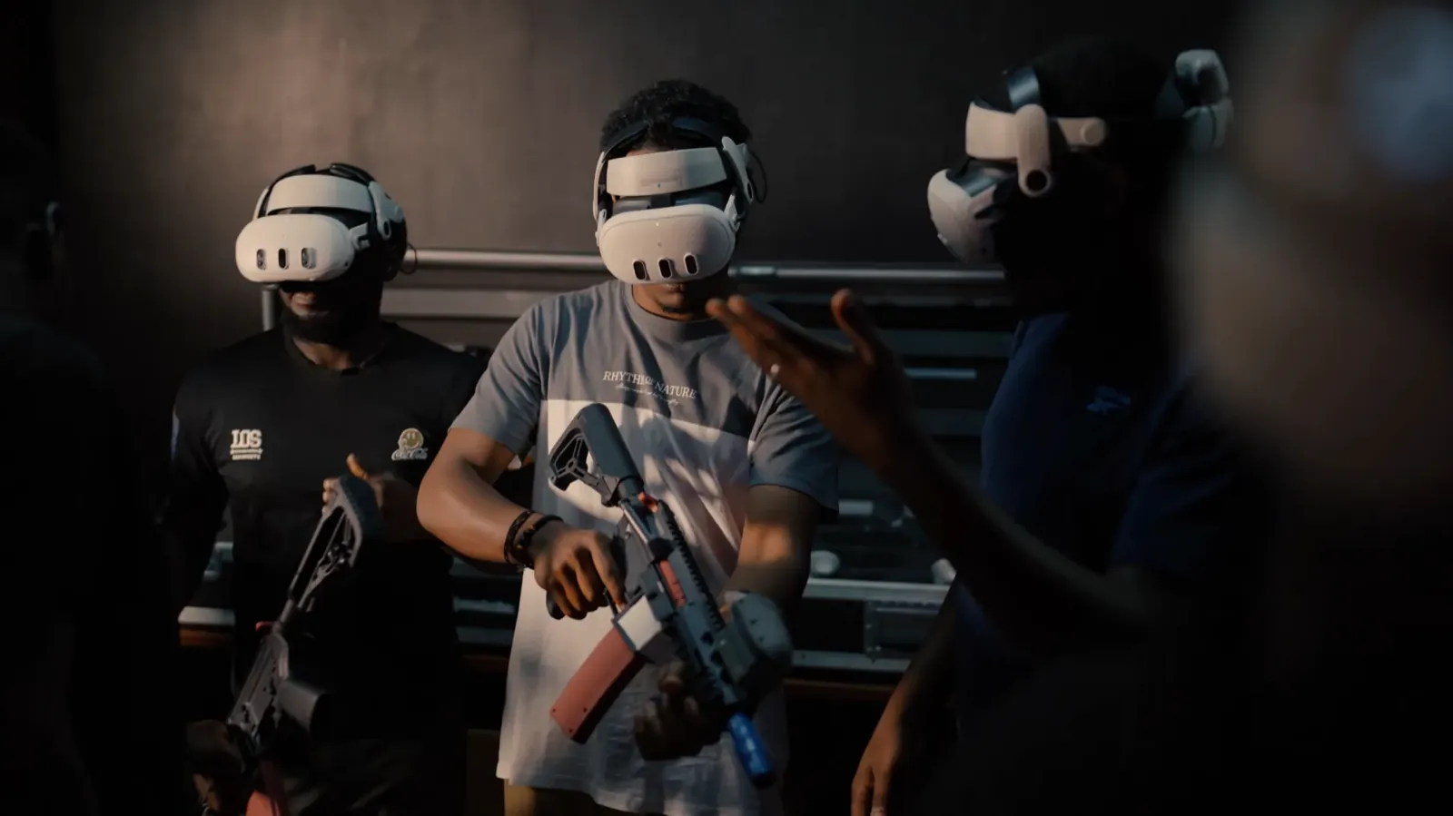 Player wearing a VR headset and holding a rifle inside a Combatica arena