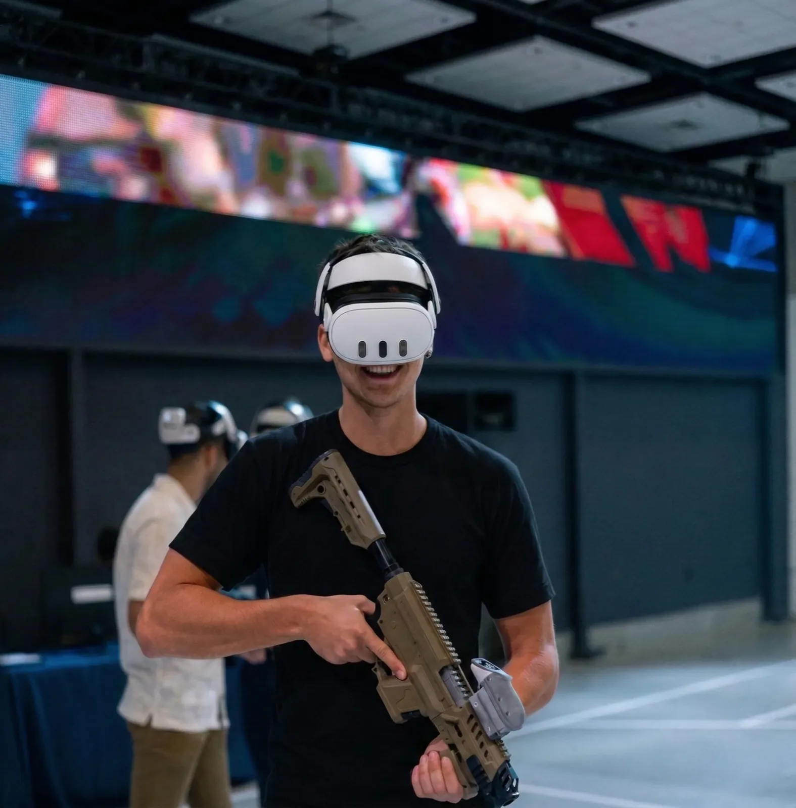 Operator with VR headset and rifle ready to play
